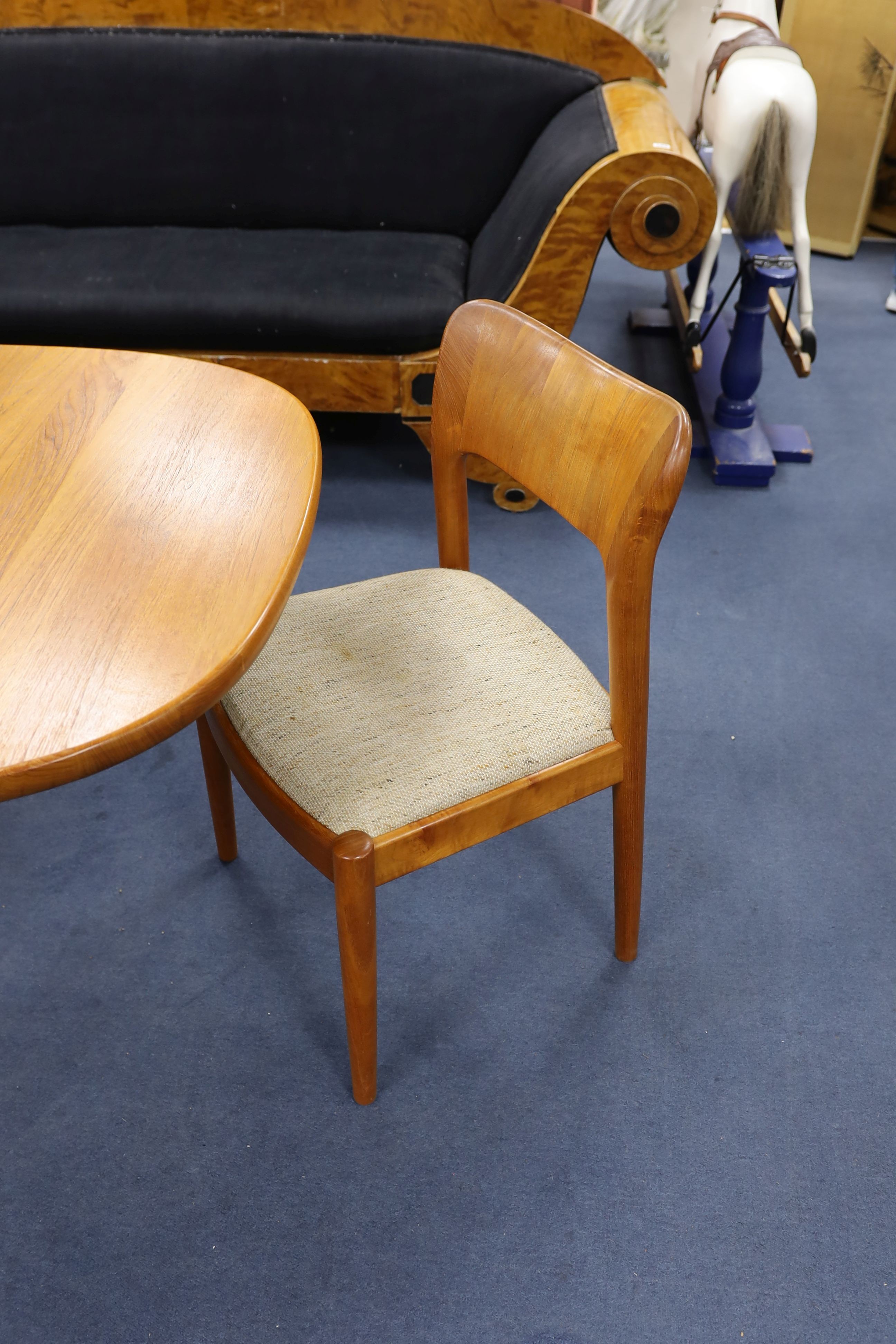 Mid century design. A Niels Koeford Danish teak extending dining table and four chairs, 222cm extended, width 89cm, height 73cm